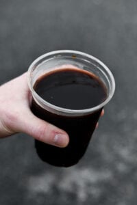 A hand holding a cup of iced coffee from Chick-fil-A.