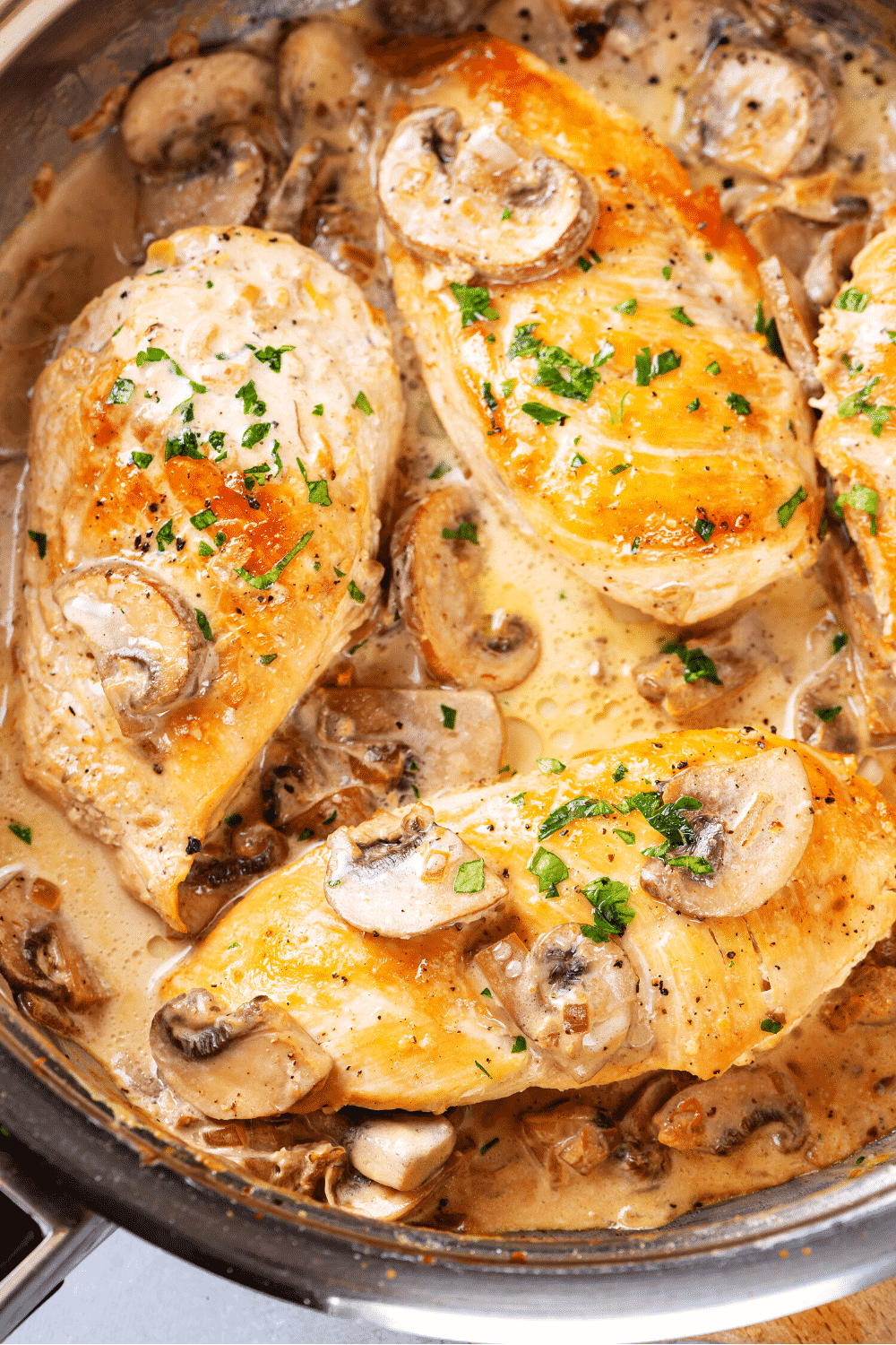 A pan filled with chicken marsala.