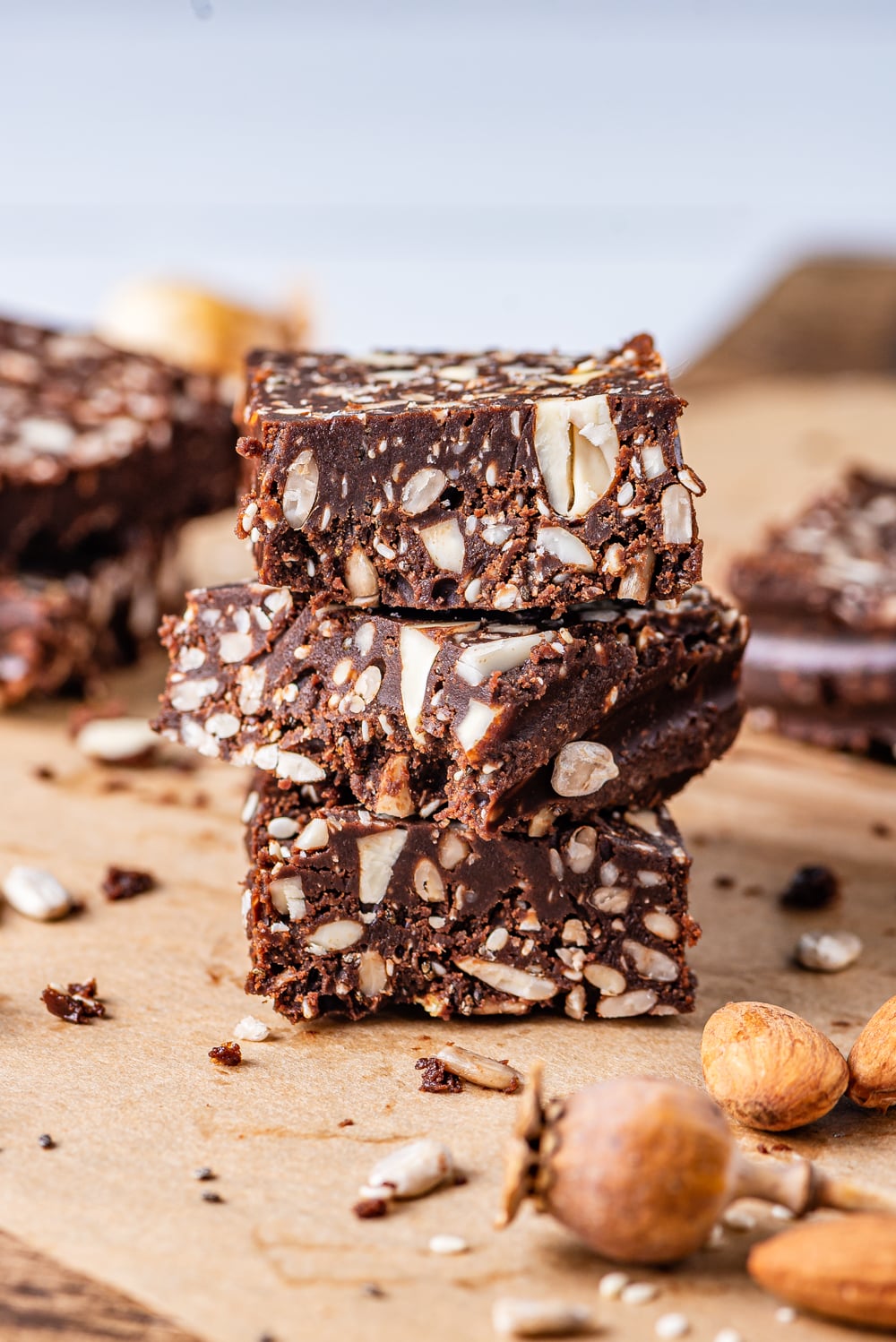 3 Chocolate bars filled with nuts stacked on top of one another.