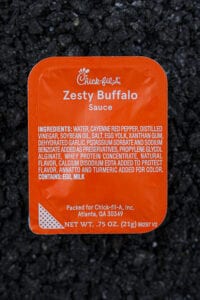 A container of zesty buffalo sauce from Chick-fil-A.