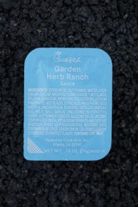 A container of garden herb ranch sauce from Chick-fil-A.