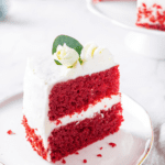 A piece of red velvet cake on a white plate.