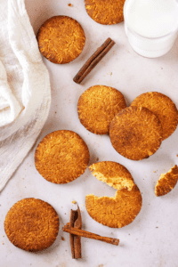 A couple of snickerdoodle cookies on a white counter.