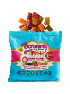 A bag of scrummy gummy bears. There are a bunch of gummy bears coming out of the top of the bag.