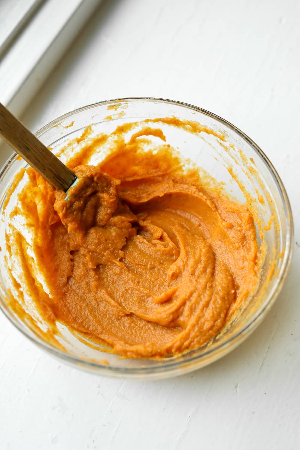 A bowl full of pumpkin pie filling.