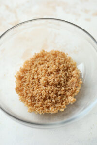 A spiced crumble inside of a glass bowl.