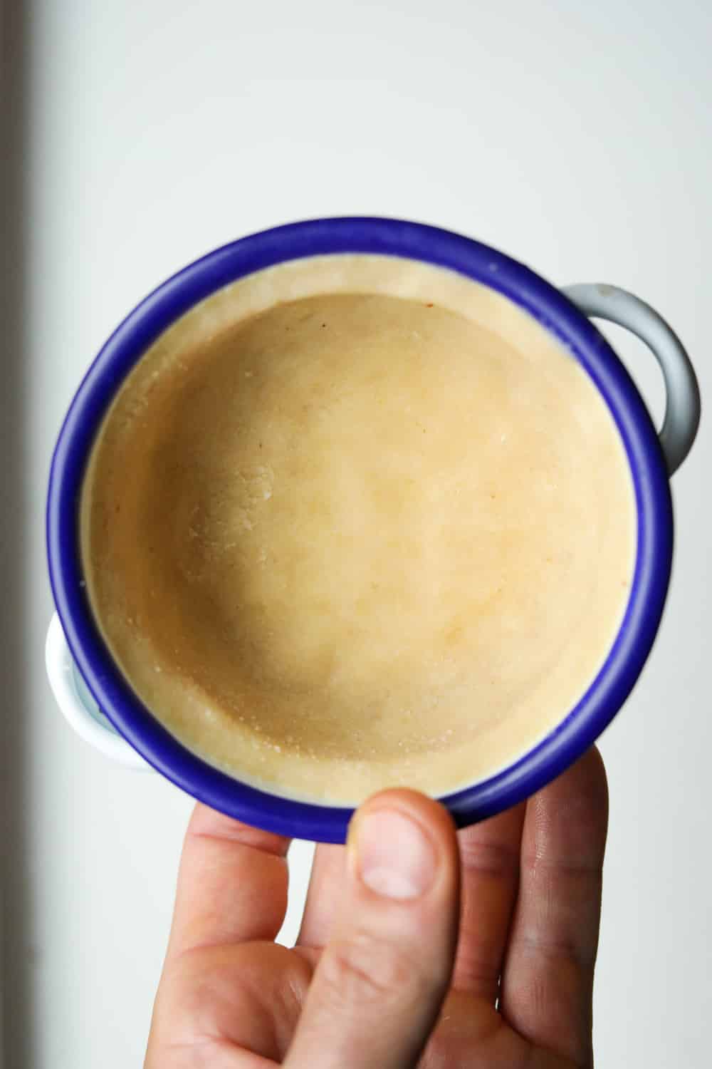 Pie crust in a bowl with a blue rim.