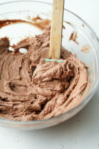 A thick chocolate filling in a glass bowl.