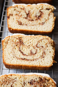 3 Slices of cinnamon swirl bread on a drying rack.