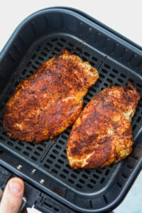 2 Chicken breasts in an air fryer.