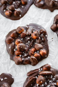 Nut clusters on a sheet of white parchment paper.