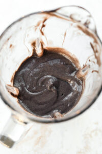 A blender filled with an Oreo protein shake,