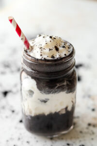 An oreo keto protein shake in a glass jar.