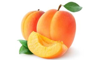 A slice of apricot in front of to whole apricots.