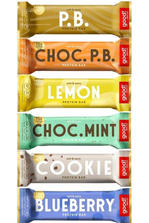 A peanut butter, chocolate peanut butter, lemon, chocolate man, cookie, and blueberries good protein bars in a row.