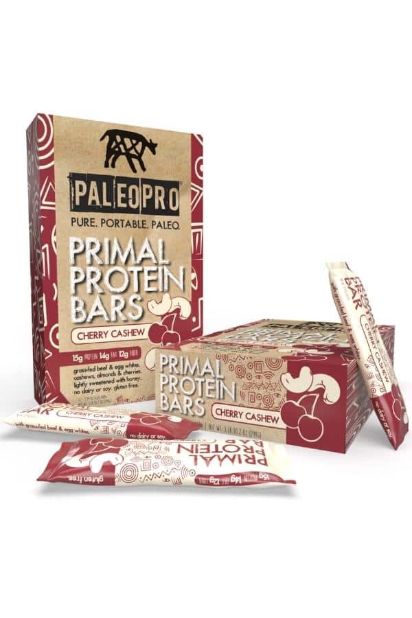 Two boxes of Palio pro primal protein bars cherry cashew flavor.