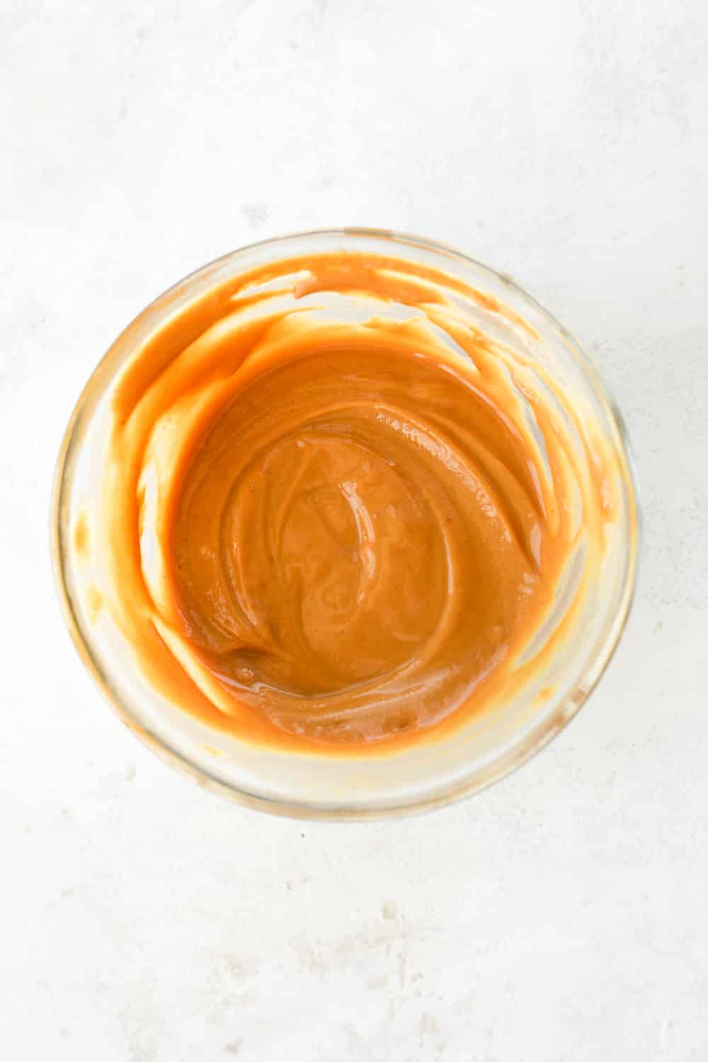 Low-calorie peanut butter in a glass jar.
