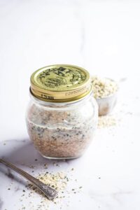 Sealed glass jar filled with keto overnight oats.