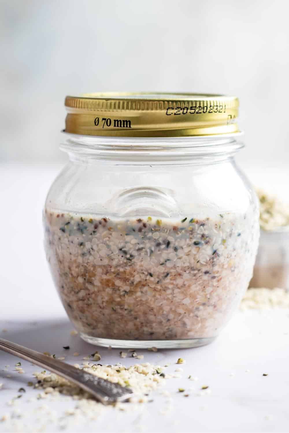 Sealed glass jar that is filled with low carb overnight oats.