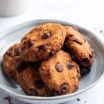 A couple of protein cookies overlapping one another in a bowl.