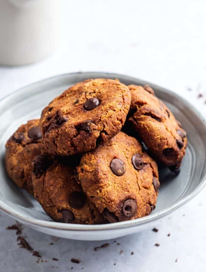 A couple of protein cookies overlapping one another in a bowl.