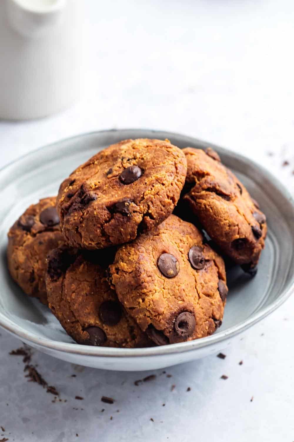A couple of protein cookies overlapping one another in a bowl.