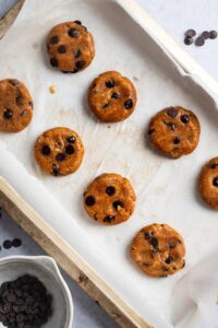 Two rows of four flattened protein cookie dough balls.