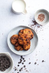 A bunch of protein cookies on top of a plate.