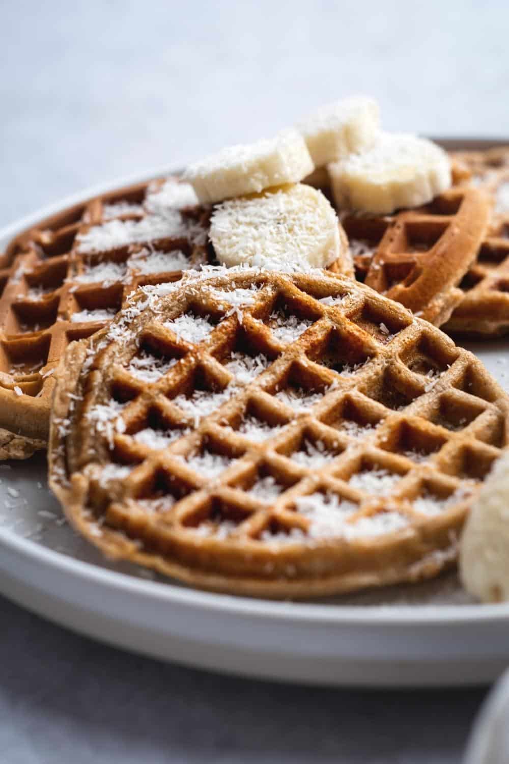 A few protein waffles on a white plate.