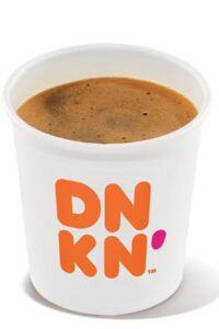 A small white cup of dunkin donuts espresso.