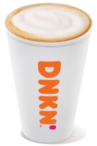 A white cup filled with dunkin donuts hot cappuccino.