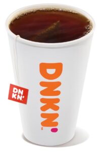 A white cup filled with dunkin donuts hot tea.