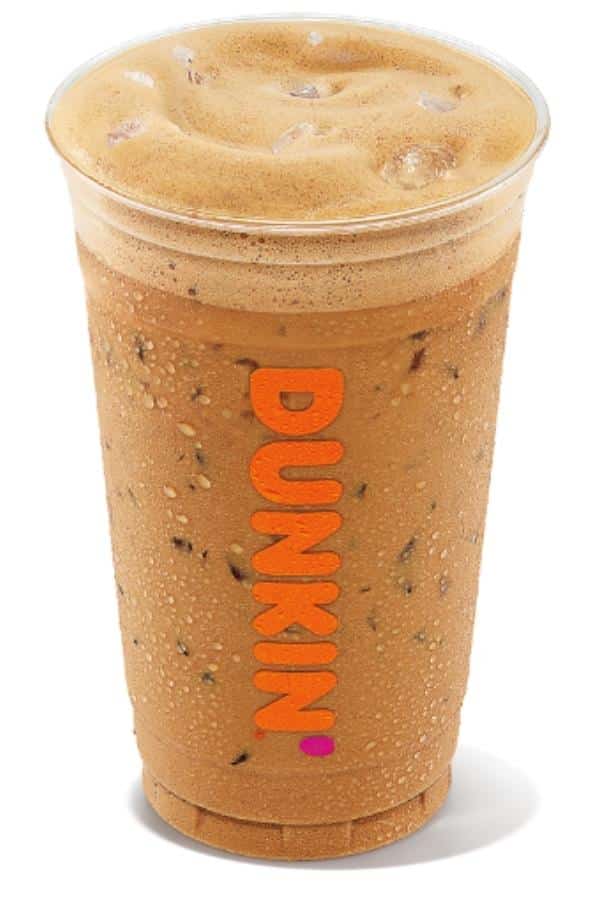 A clear cup filled with dunkin donuts iced cappuccino.