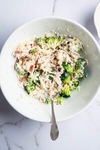 A white bowl filled with a mixture of chicken bacon ranch casserole.