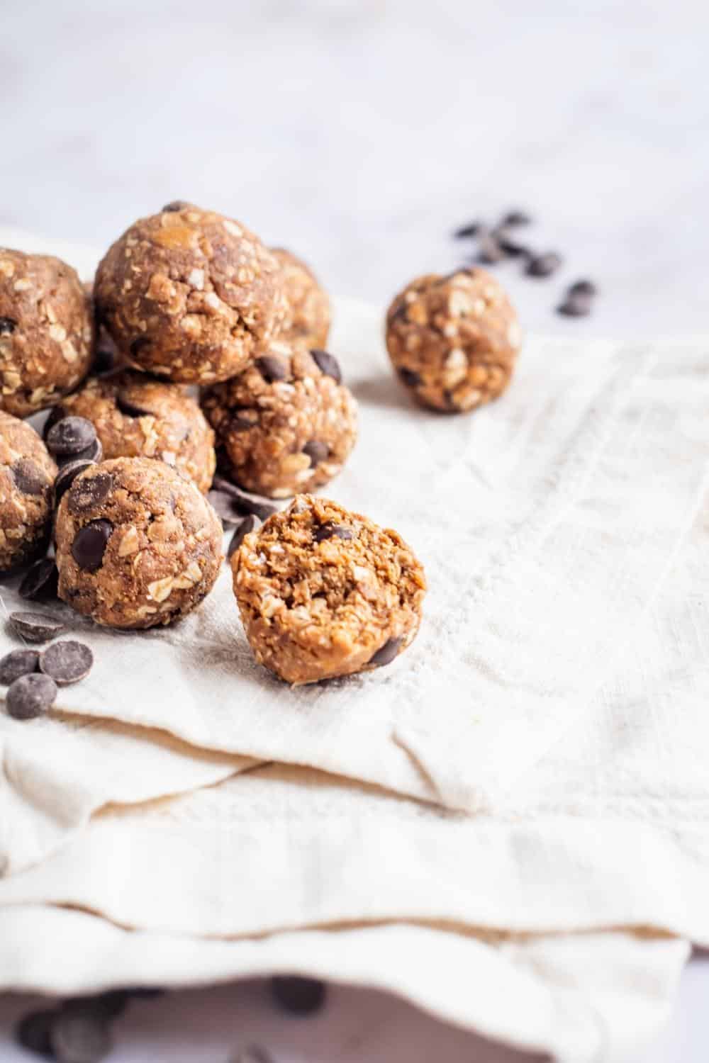 A bunch of protein balls on a tablecloth.