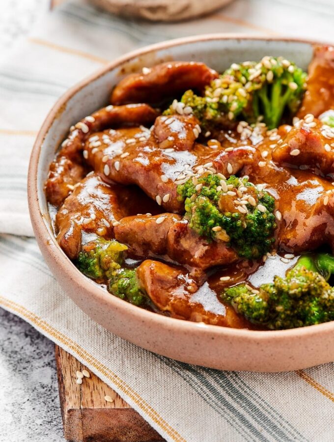 Part of a bowl of beef and broccoli stir fry.