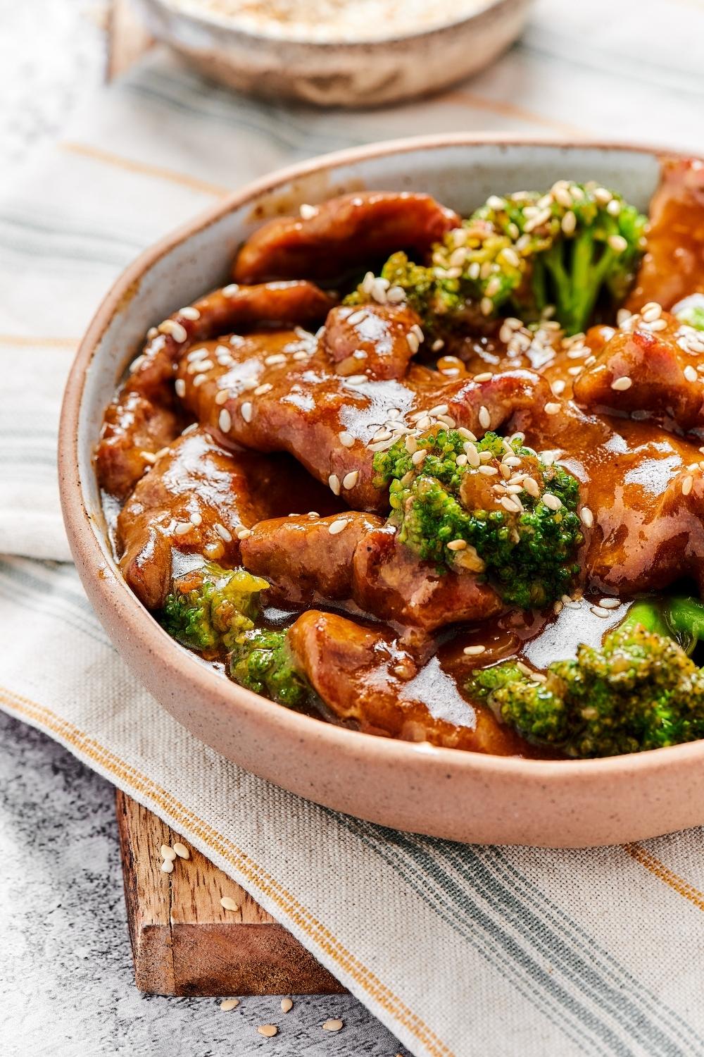 Part of a bowl of beef and broccoli stir fry.