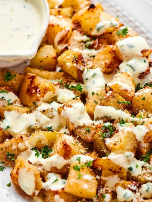 Roasted kohlrabi with a yogurt dressing on top.