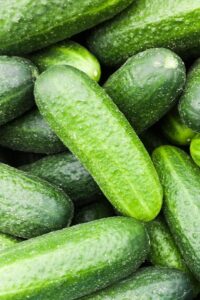 Cucumbers stacked on top of each other.