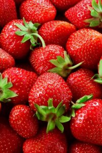 Strawberries stacked on top of one another.