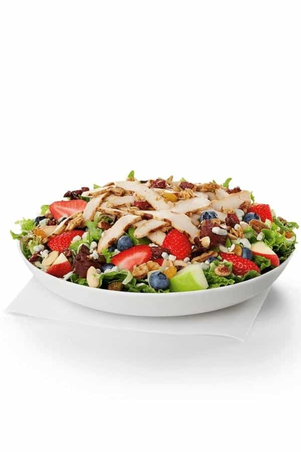 A chick fil a grilled market salad in a white bowl.