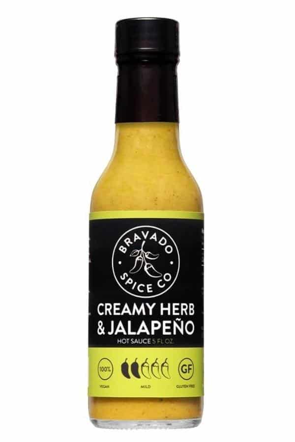 A bottle of Bravado Spice Co. creamy herb and jalapeno hot sauce.