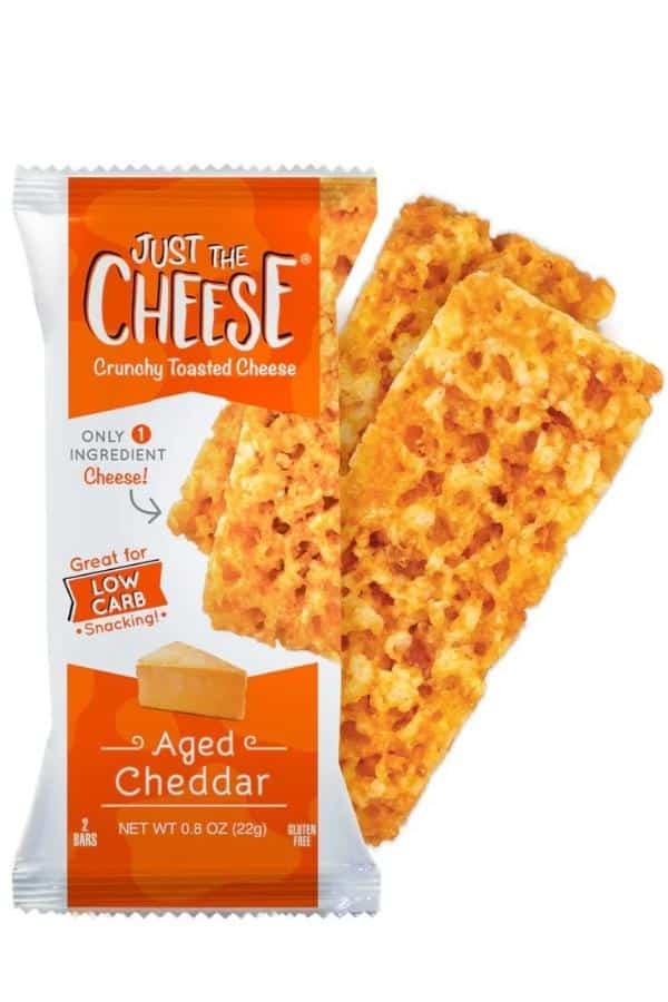 A pack of Just The Cheese aged cheddar bars with part of the two of the bars next to the package.