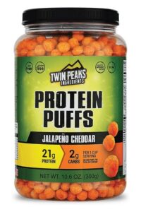 A container Twin Peaks ingredients protein puffs jalapeno cheddar flavor.