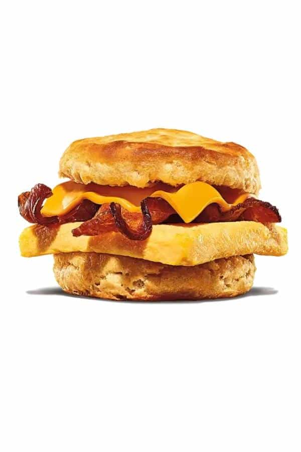 Biscuit with cheese, bacon, and an egg between it