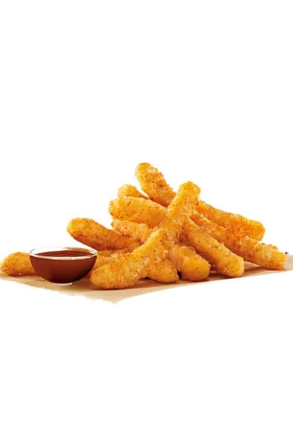 Bunch of chicken fries with a cup of barbecue sauce next to them.