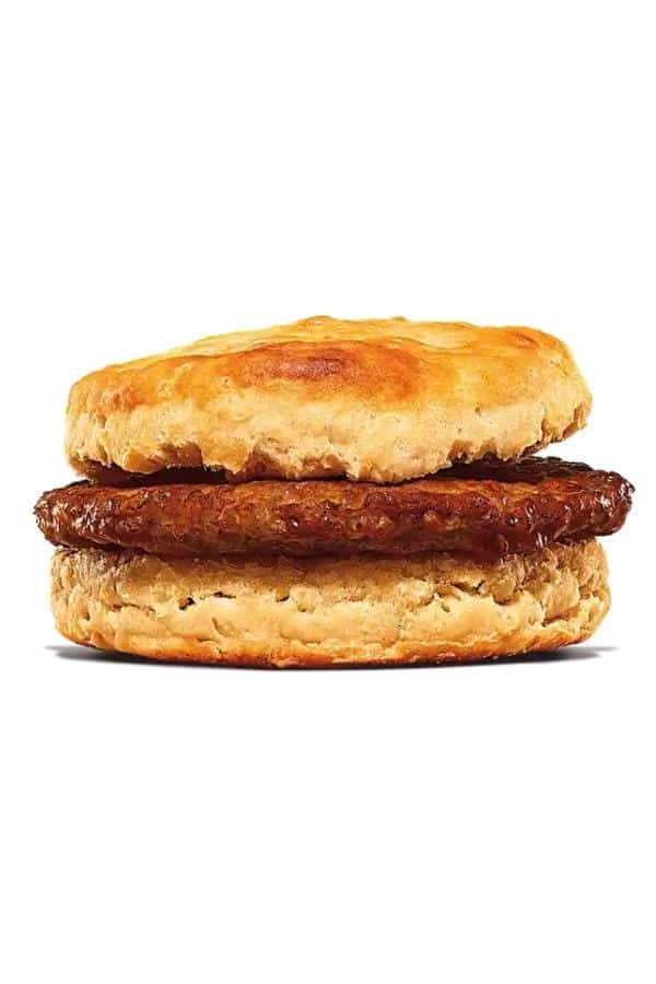 A sausage patty between a biscuit.