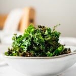 Kale chips in a white bowl.