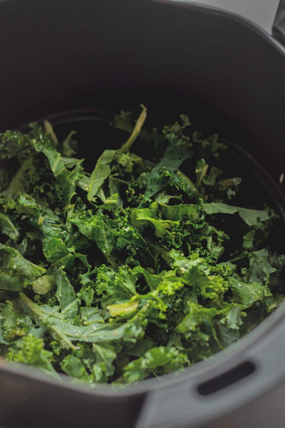 Kale chips in an air fryer.