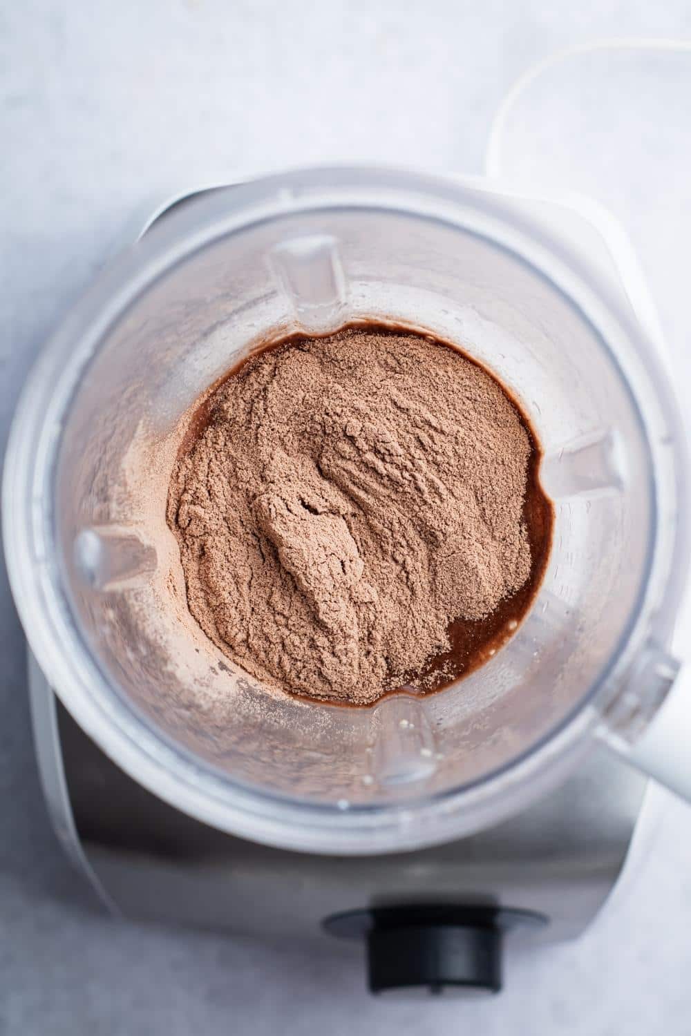 Mass gainer powder in a blender.